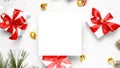 Winter background white. White gifts with red bow, golden balls and Christmas tree in xmas decoration on white background for Royalty Free Stock Photo