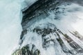 Winter Baikal. Olkhon Island. Ice grotto. Thick blue ice and icicles on the coastal rocks of Olkhon Island in winter Royalty Free Stock Photo