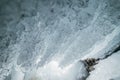 Winter Baikal. Olkhon Island. Ice grotto. Thick blue ice and icicles on the coastal rocks of Olkhon Island in winter Royalty Free Stock Photo