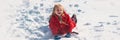 Winter banner. Cute girl playing in snow. Child in snow. Kid winter portrait. Cute child in frosty winter Park. Happy Royalty Free Stock Photo