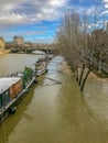 Barges and houseboats moored in the flooded Seine, Paris, France