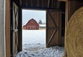 Winter barn with open door Royalty Free Stock Photo