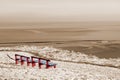 Winter beach view and red benches Royalty Free Stock Photo