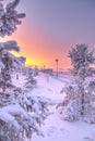 Winter beautiful sunset and mist above the water of river. Frosty weather, trees are covered with fluffy hoarfrost - urban winter