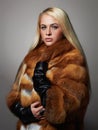 Winter beautiful Woman in Fur Coat. Beauty Fashion Model Girl Royalty Free Stock Photo