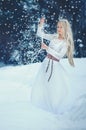 Winter Beauty Woman. Beautiful fashion model girl with snow hairstyle and makeup in the winter forest. Festive makeup and manicure Royalty Free Stock Photo