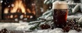 A winter beer scene with a stout beer, snow-covered branches, and a cozy winter setting with a Royalty Free Stock Photo