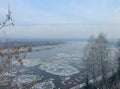 Winter begins and the river is covered with ice