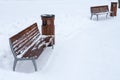 Winter bench covered with snow. Winter park.