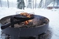 Outdoors winter barbecue with sausages Royalty Free Stock Photo