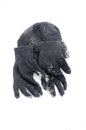 Winter black Knit Gloves and warm hat on a snow Royalty Free Stock Photo