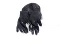 Winter black Knit Gloves and warm hat on a snow Royalty Free Stock Photo