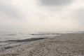 Winter black sea beach in winter sky landscape Royalty Free Stock Photo