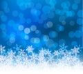 Winter blue bokeh xmas background with snowflakes. Christmas bokeh holiday decoration for greeting card Royalty Free Stock Photo