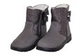 Winter boots. Close-up of a pair elegant gray silver leather winter boots lined with white leather. Girls winter shoe fashion new Royalty Free Stock Photo