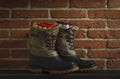 Winter boots with warm wool socks near the fireplace