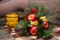 Winter bouquet of fir twigs and Mimosa and ashberry and red apples