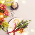 Winter bouquet, natural decoration and bokeh lights. Christmas table setting Royalty Free Stock Photo