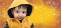 Winter Boy Child on Yellow Snowflake Background