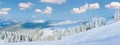 Winter calm mountain panorama landscape with sheds and mount ridge behind (Kukol Mount, Carpathian Mountains, Ukraine Royalty Free Stock Photo