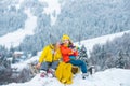 Winter camp picnic for children. Funny little boy and girl in winter clothes walks during a snowfall. Outdoors winter Royalty Free Stock Photo