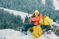 Winter camp picnic for children. Funny little boy and girl in winter clothes walks during a snowfall. Outdoors winter Royalty Free Stock Photo
