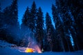 Winter camping with fire at night