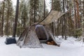 Winter camping in a snowy forest. Winter landscape with a tent Royalty Free Stock Photo