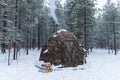 Winter camping in a snowy forest. Winter landscape with a tent Royalty Free Stock Photo