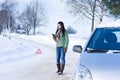 Winter car breakdown - woman call for help Royalty Free Stock Photo