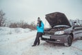 Winter car breakdown - woman call for help, road assistance Royalty Free Stock Photo