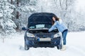 Winter car breakdown - woman call for help. Royalty Free Stock Photo