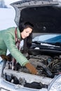 Winter car breakdown - woman repair motor Royalty Free Stock Photo