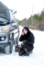 Winter car breakdown - young beautiful woman call for help, road Royalty Free Stock Photo