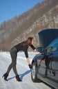 Young fashion woman trying to fix the car Royalty Free Stock Photo