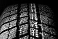 Winter car tire in rain Royalty Free Stock Photo
