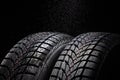 Winter Car tire and rain drops on black background Royalty Free Stock Photo