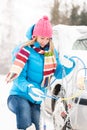 Winter car tire snow chains woman Royalty Free Stock Photo