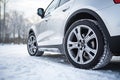 Winter car tire. Snow driving equipment. Generative Ai Royalty Free Stock Photo