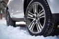 Winter car tire. Snow driving equipment. Generative Ai Royalty Free Stock Photo