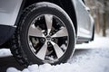 Winter car tire. Snow driving equipment. Generative Ai Royalty Free Stock Photo