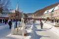 winter carnival, with skating and snow sculpture competitions, in picturesque town