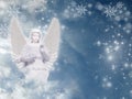 Winter Christmas angel with snow and sky and copy space