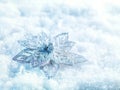 Winter and Christmas background. Beautiful sparkling silver and red Christmas decoration on a white snow background. Royalty Free Stock Photo