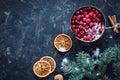 Winter, Christmas background with frozen cranberies, spices and fir tree Royalty Free Stock Photo