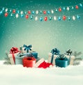 Winter christmas background with gifts and a garland.