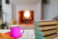 Winter christmas books background. A stack of antique books with a coffee mug and Italian pastries on a wooden table over abstract Royalty Free Stock Photo