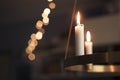 Candles glowing on advent chandelier