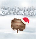 Winter christmas landscape with a wooden ornate sign