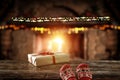 Christmas time, legs in winter socks. Space for your text or decoration. Old fireplace wall background. Royalty Free Stock Photo